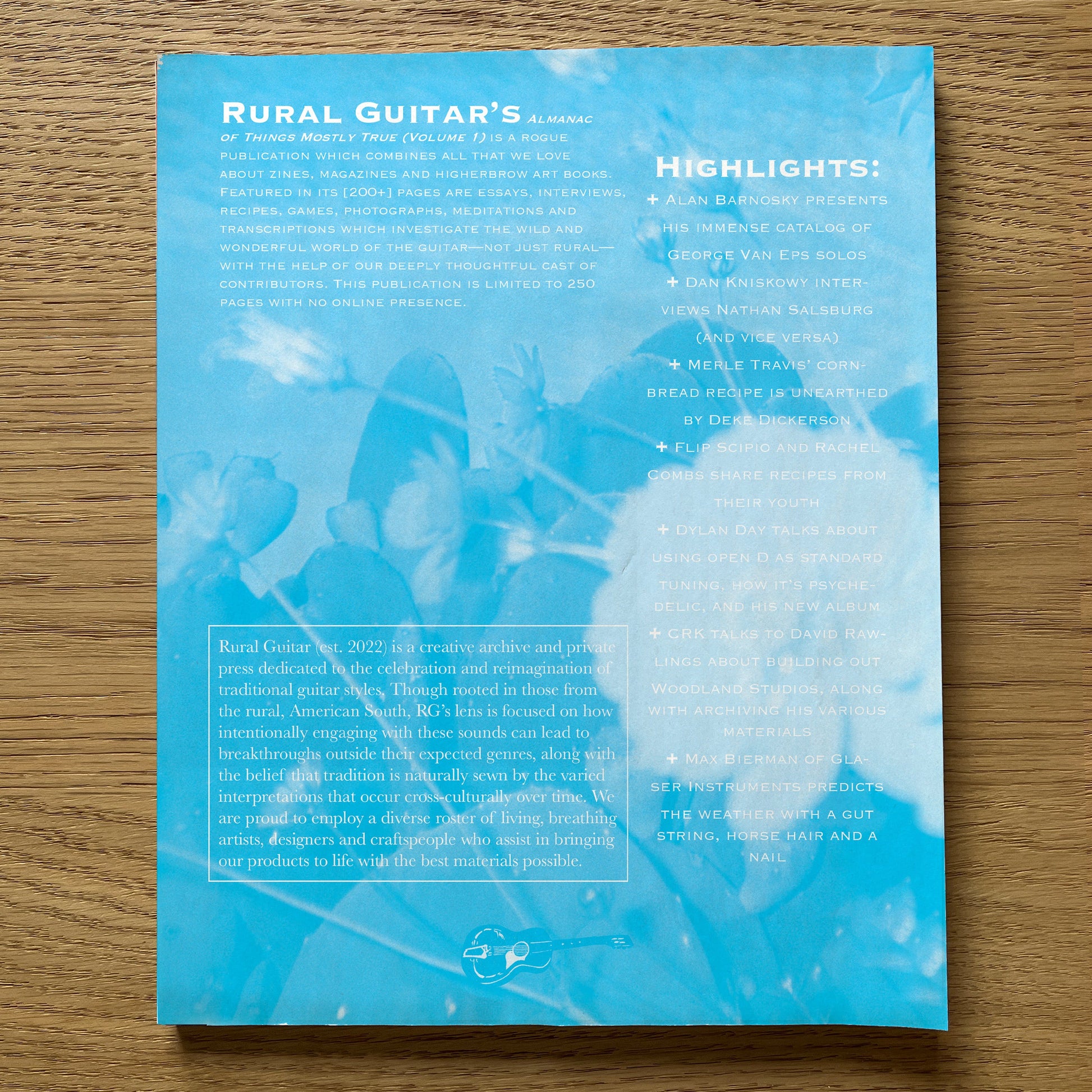 Blue book cover with text on a wooden surface